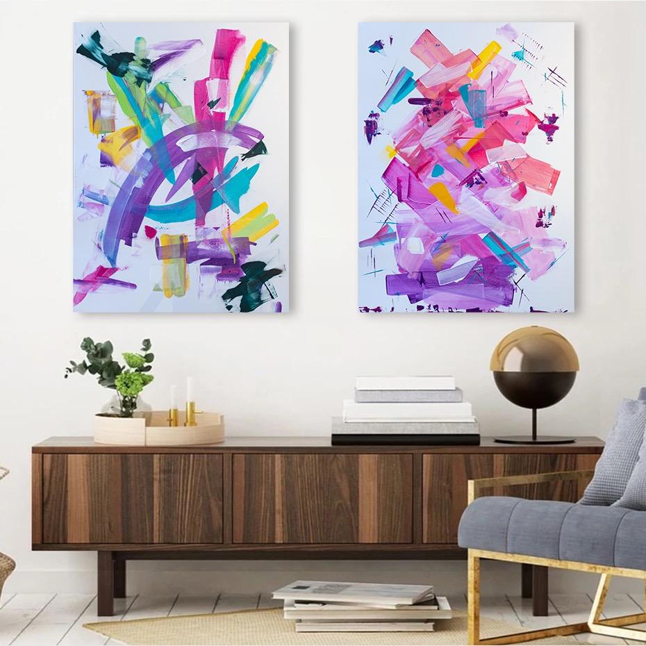 Two swish series paintings in a living room